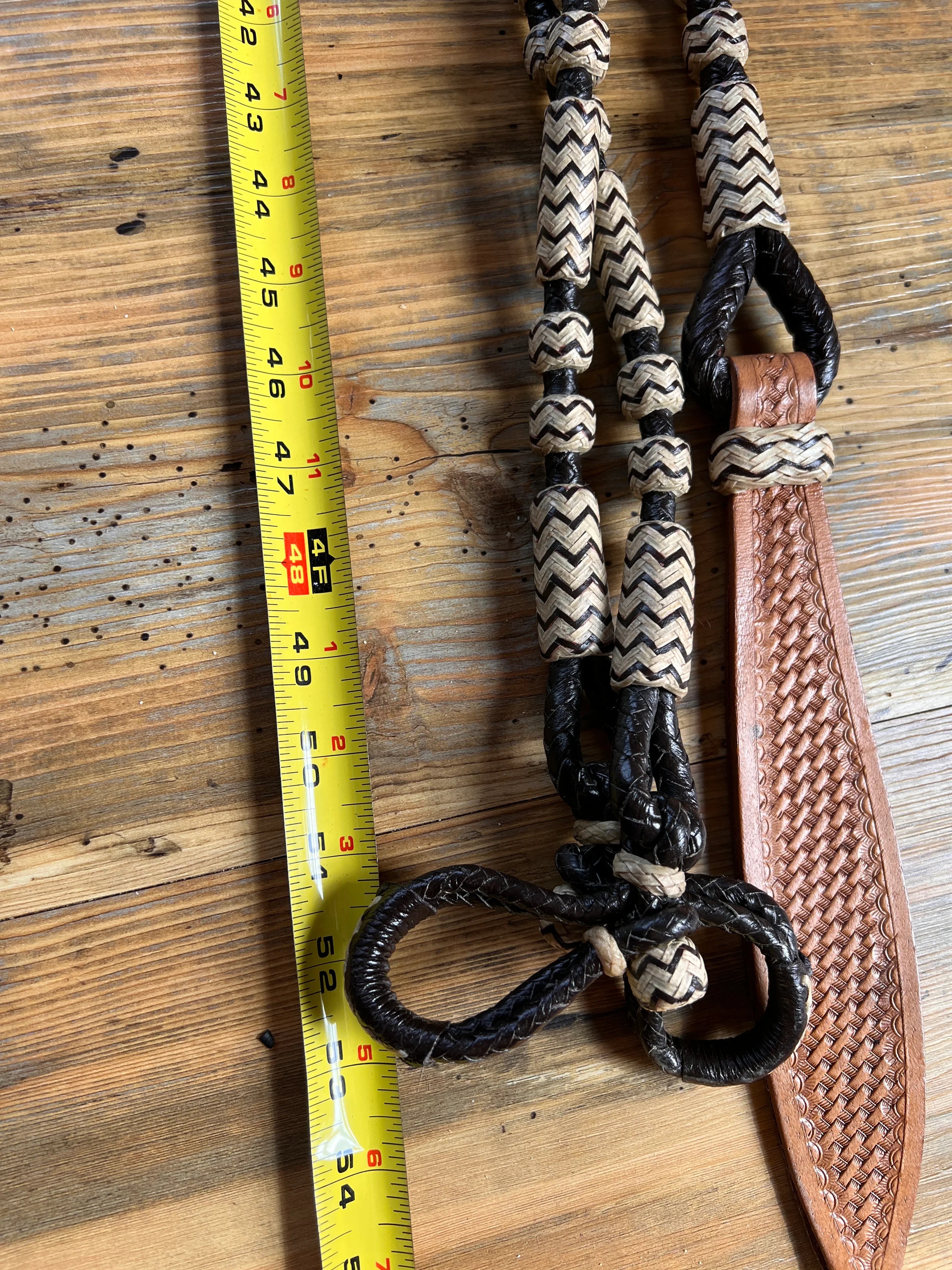 Black and cream 10-plait zigzag braided Romal reins, 55in dark brown with tan strap