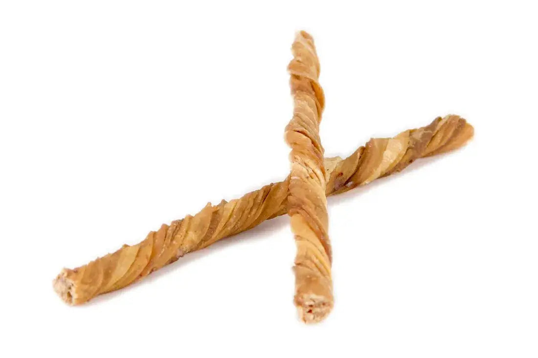 Two golden-brown twisted 10” Tripe Twist breadsticks crossed together