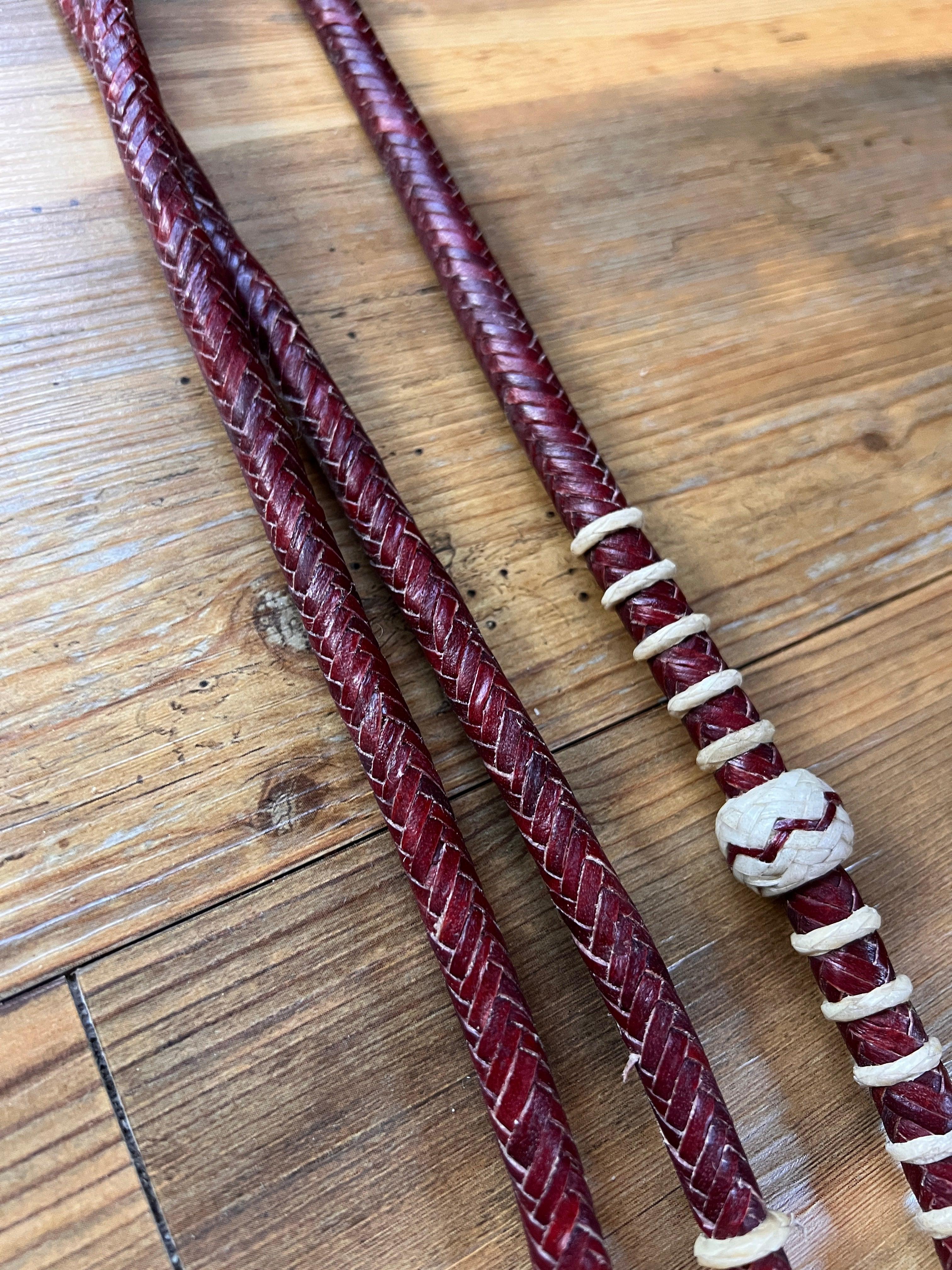 Deep red 20-plait romal reins with white accents, cherry rawhide bead, 55