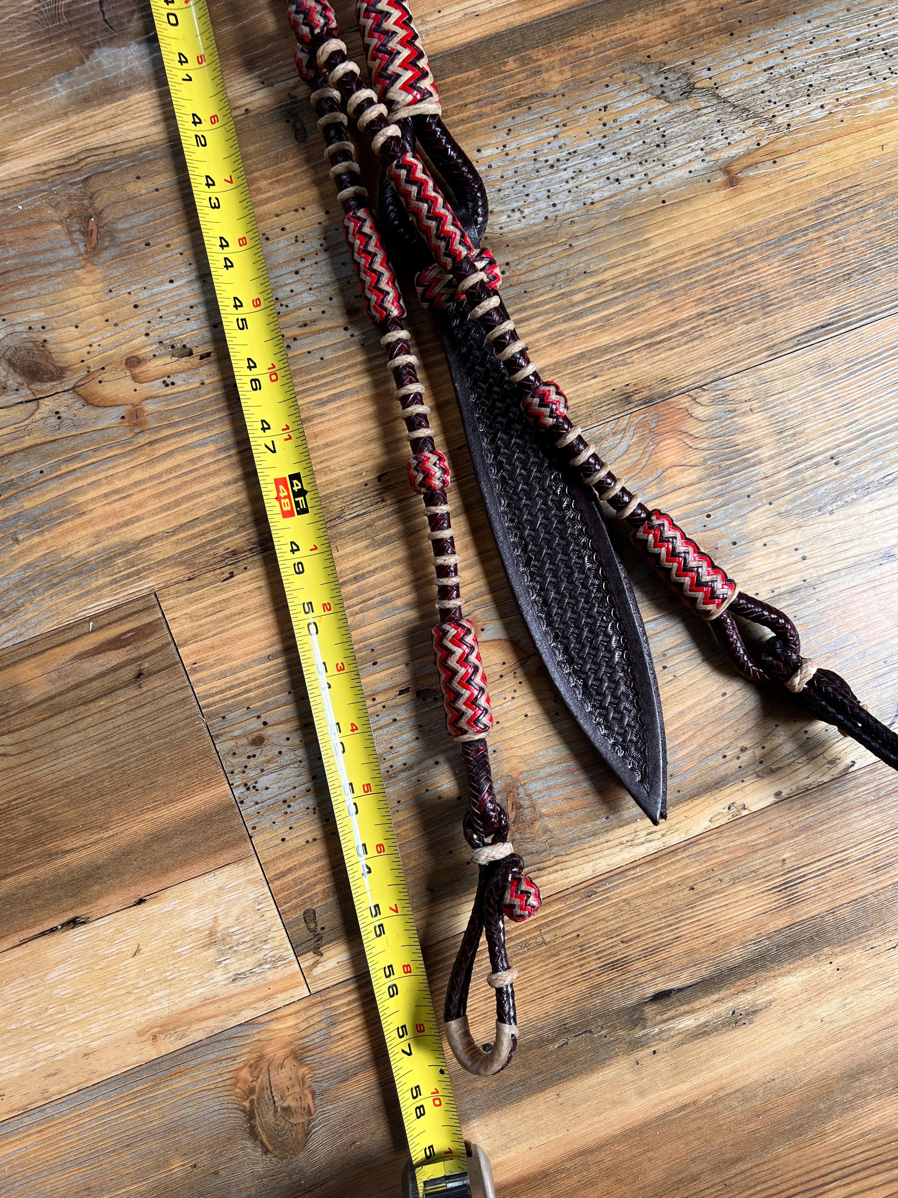 Red and brown 20-plait braided romal reins with black tooled strap, 55 inch