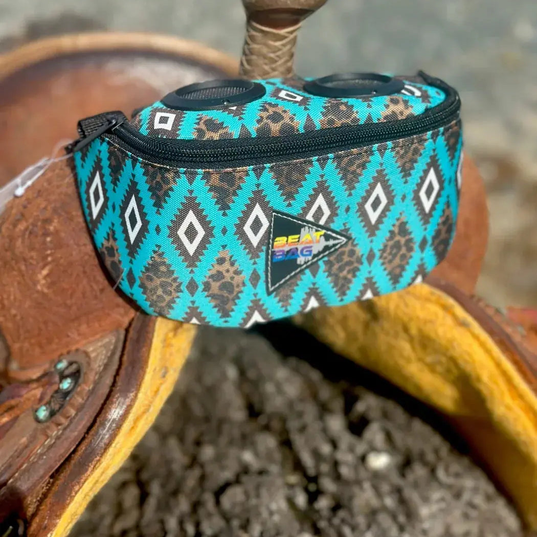 Turquoise brown leopard-print Beat Bag with diamond design, black zippers