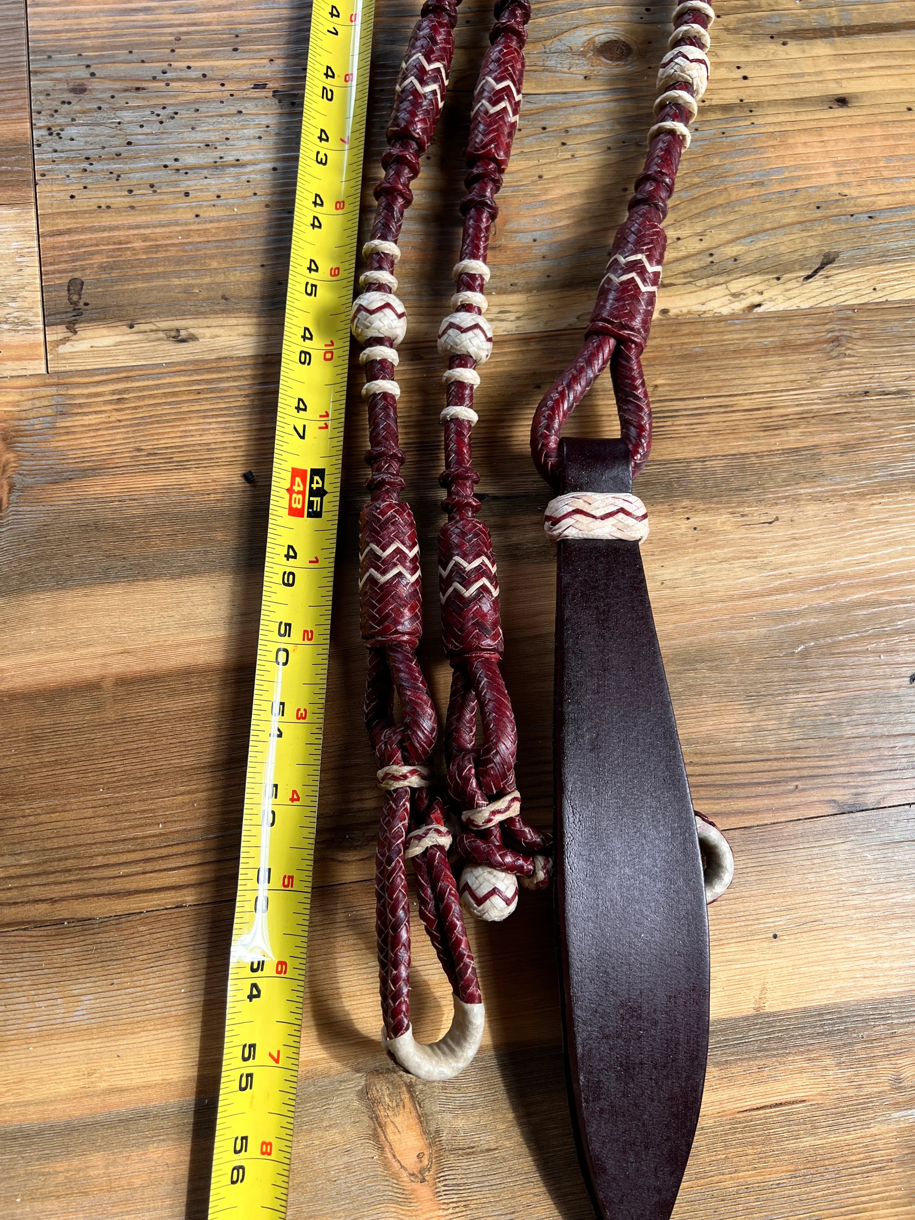 Maroon and cream braided leather horse halter with zigzag stitching
