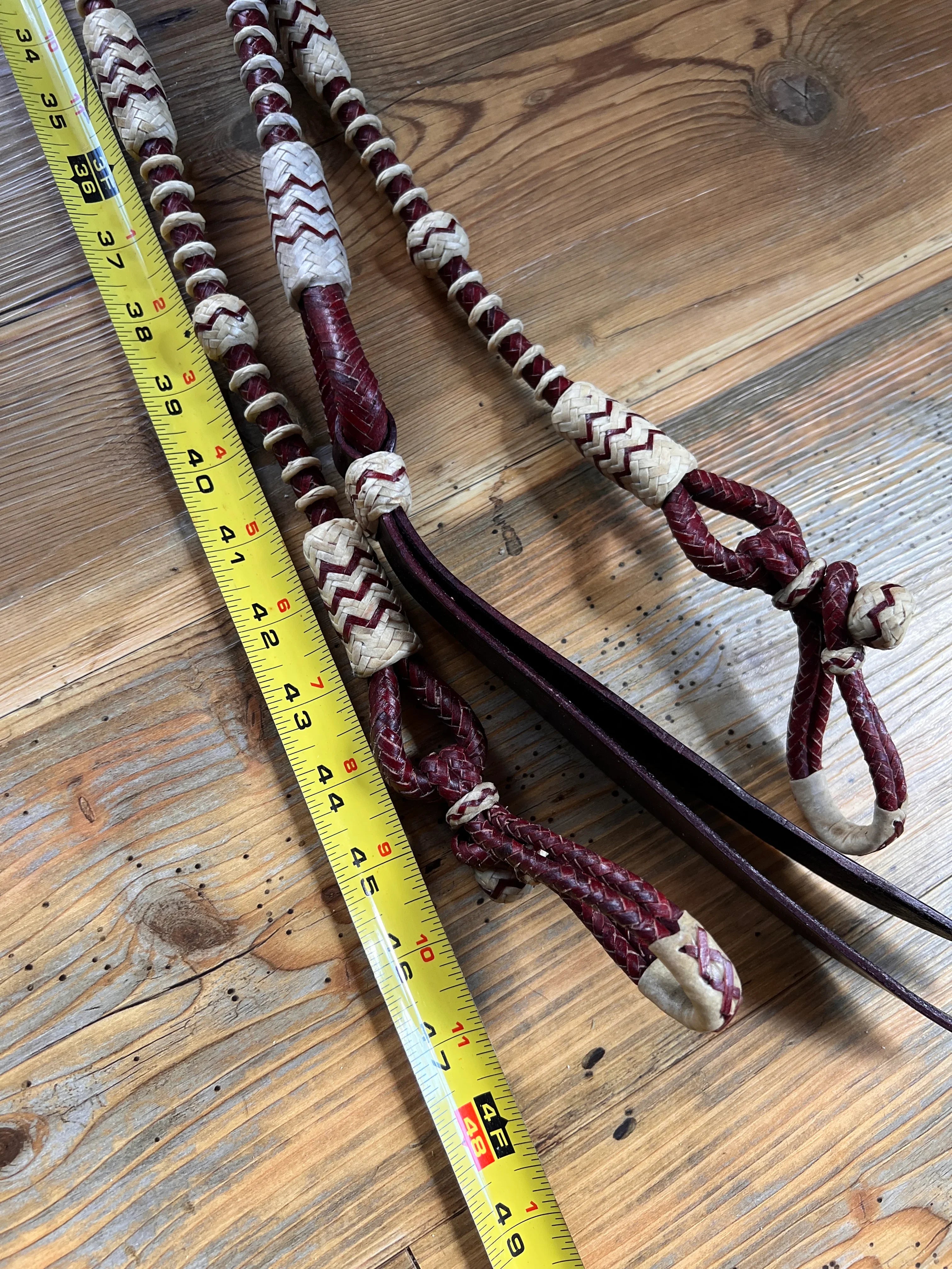 Maroon cream 20-plait romal reins with zigzag braids, 55in California style