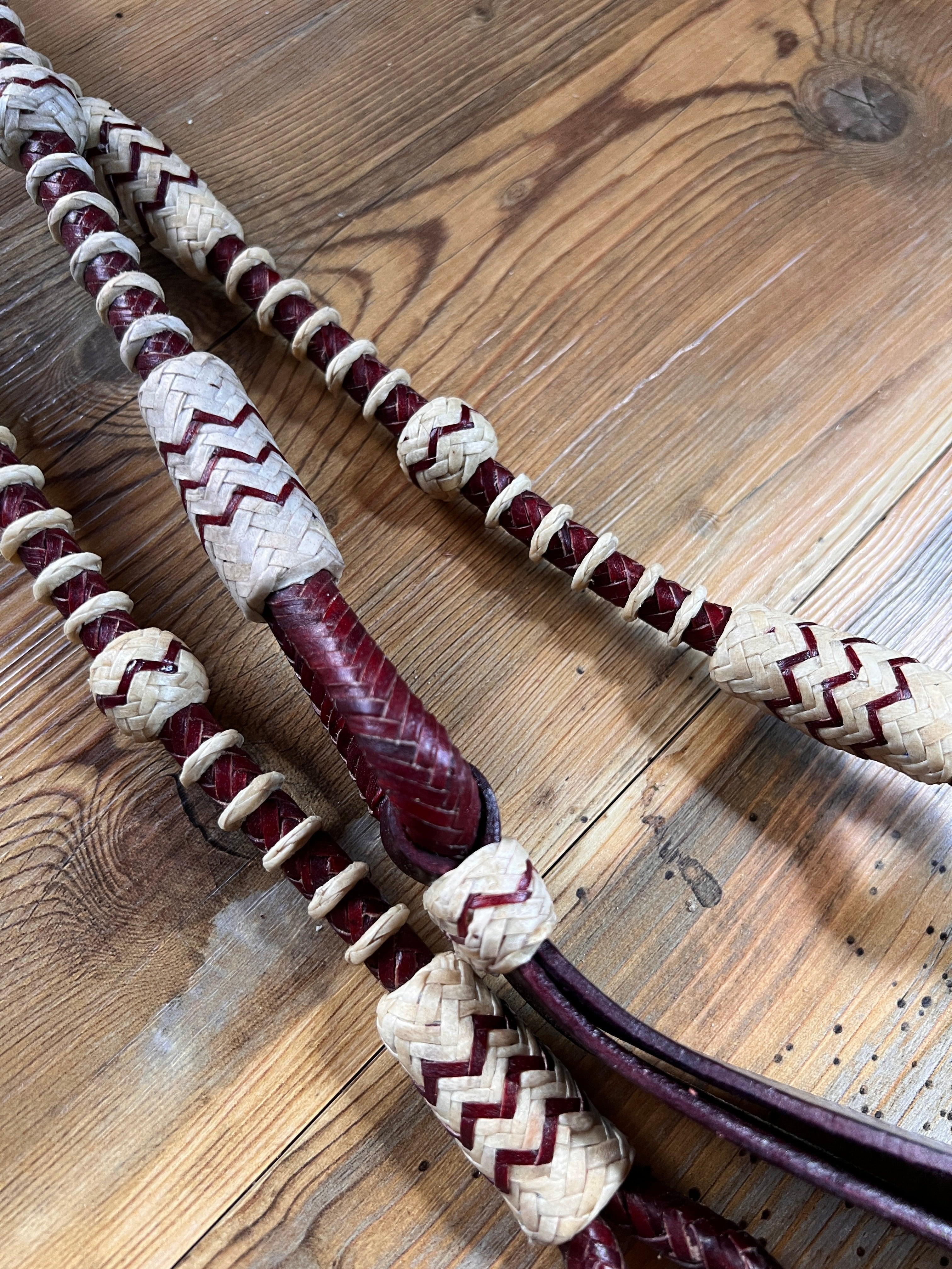 Handcrafted 20-plait romal reins in chestnut cherry with maroon cream patterns, 55 inches
