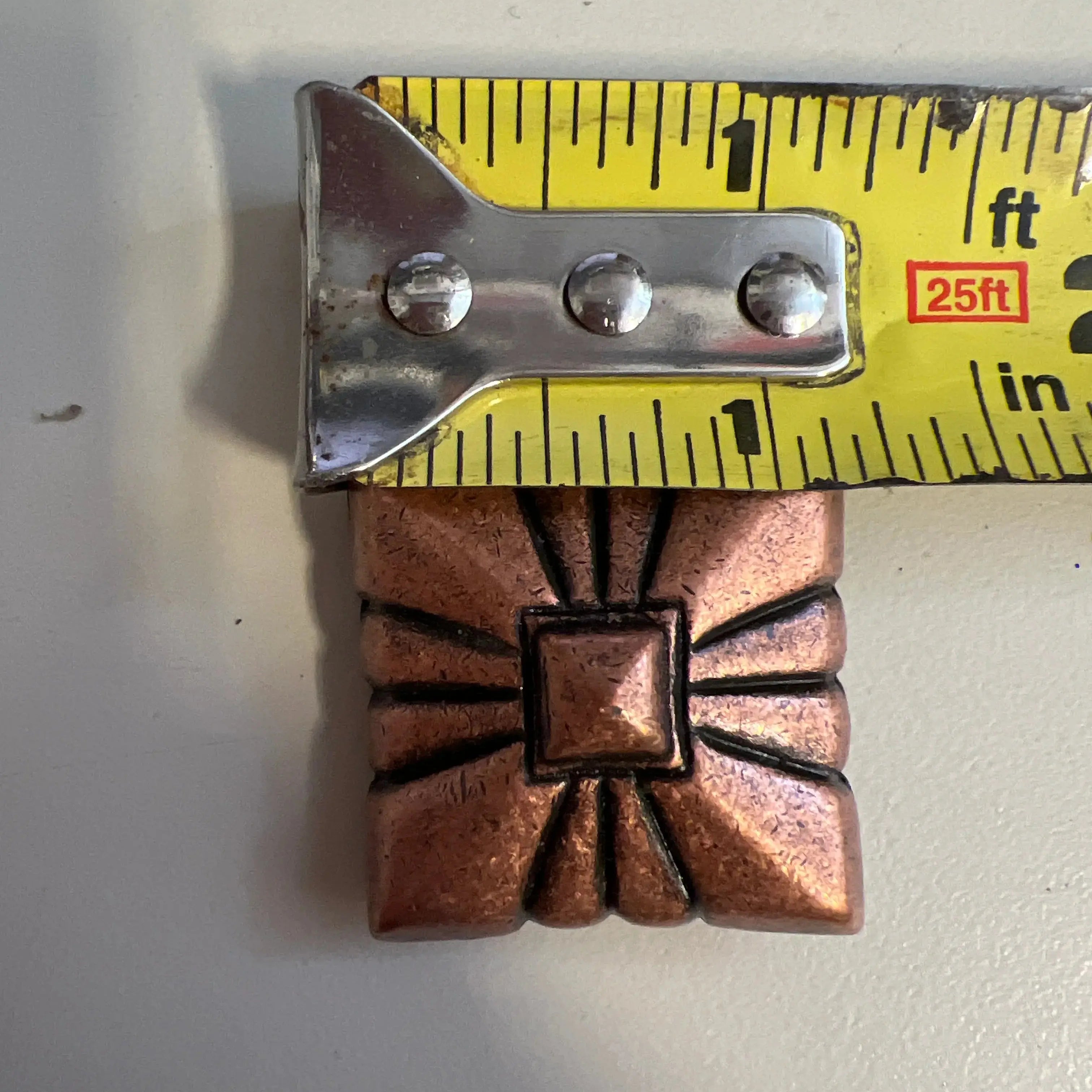Copper pyramid embossed shape concho