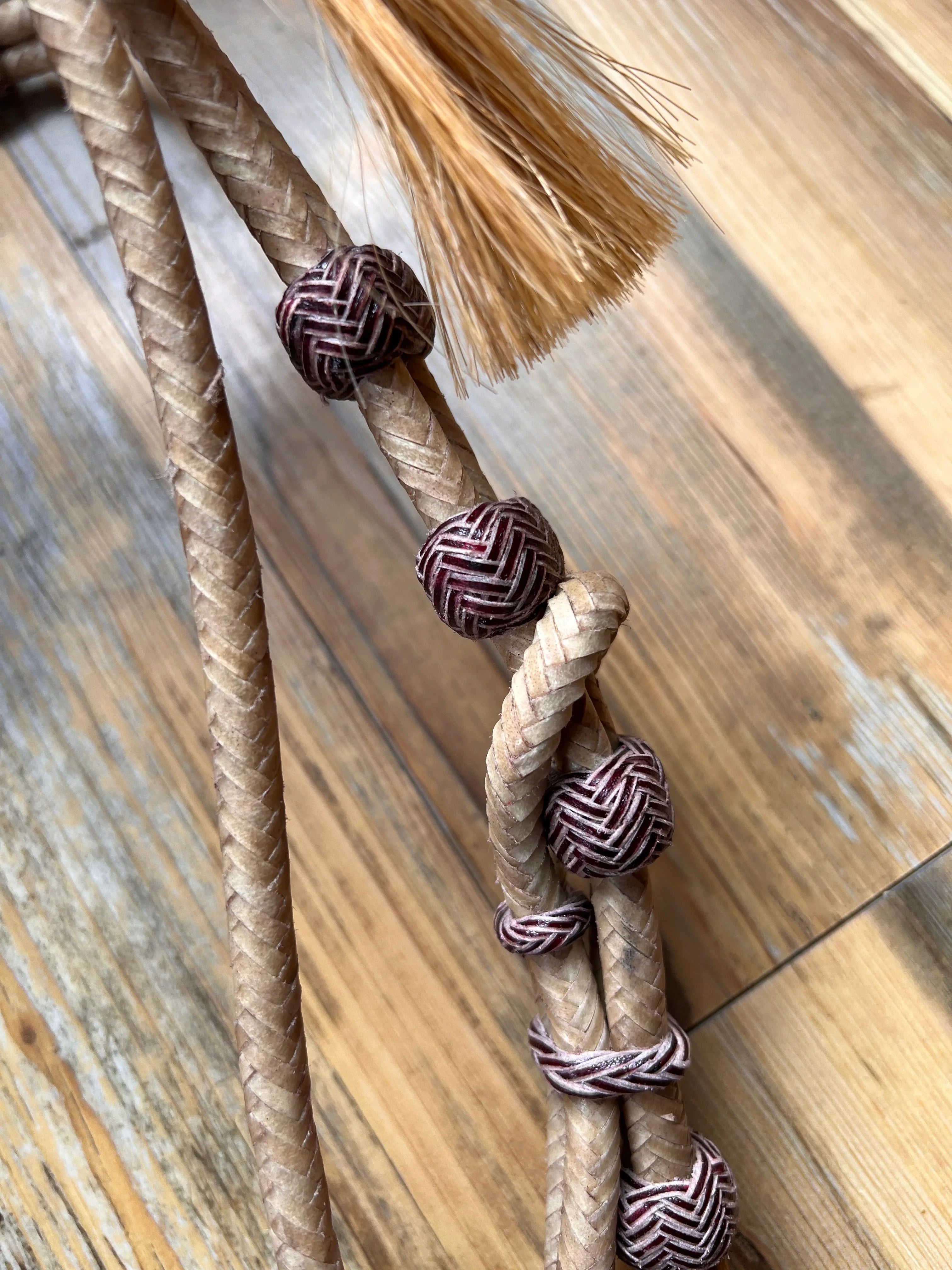 Rawhide Broadband Headstall with tan braided rope, purple beads, brush tip