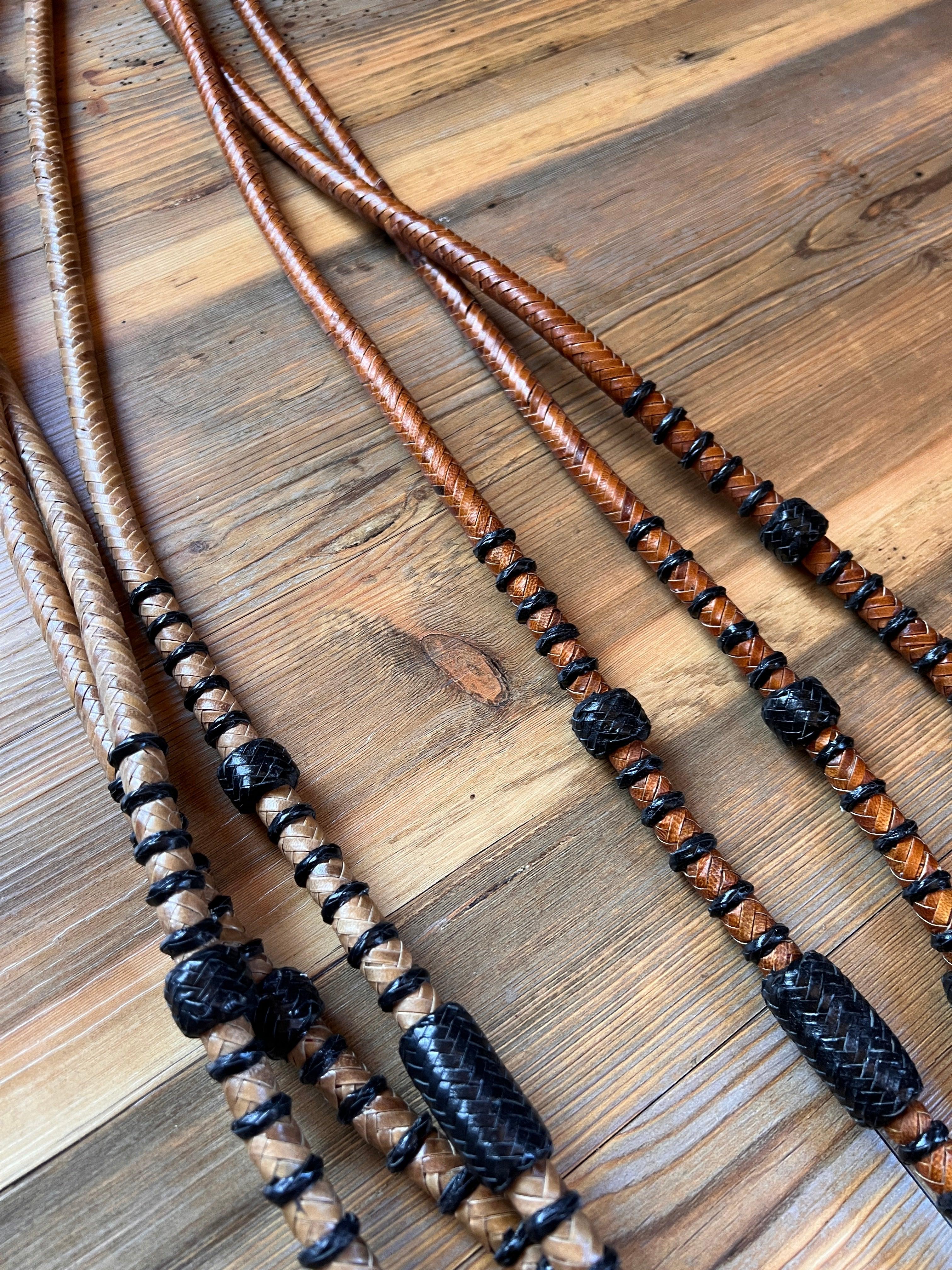 Romal reins with black rawhide: brown black braided leather lanyards beads