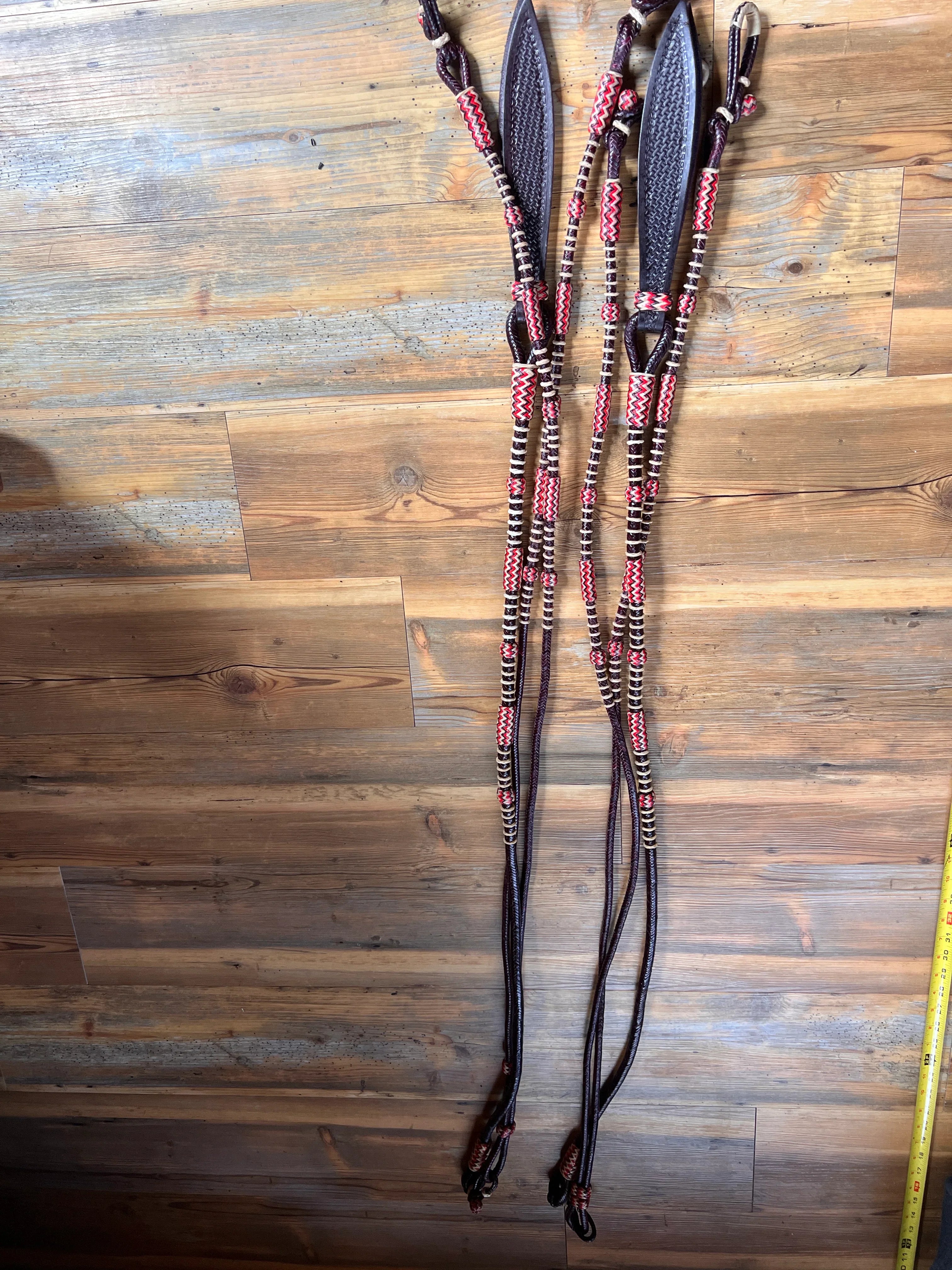 Black leather horse headstall with red white braided accents California style