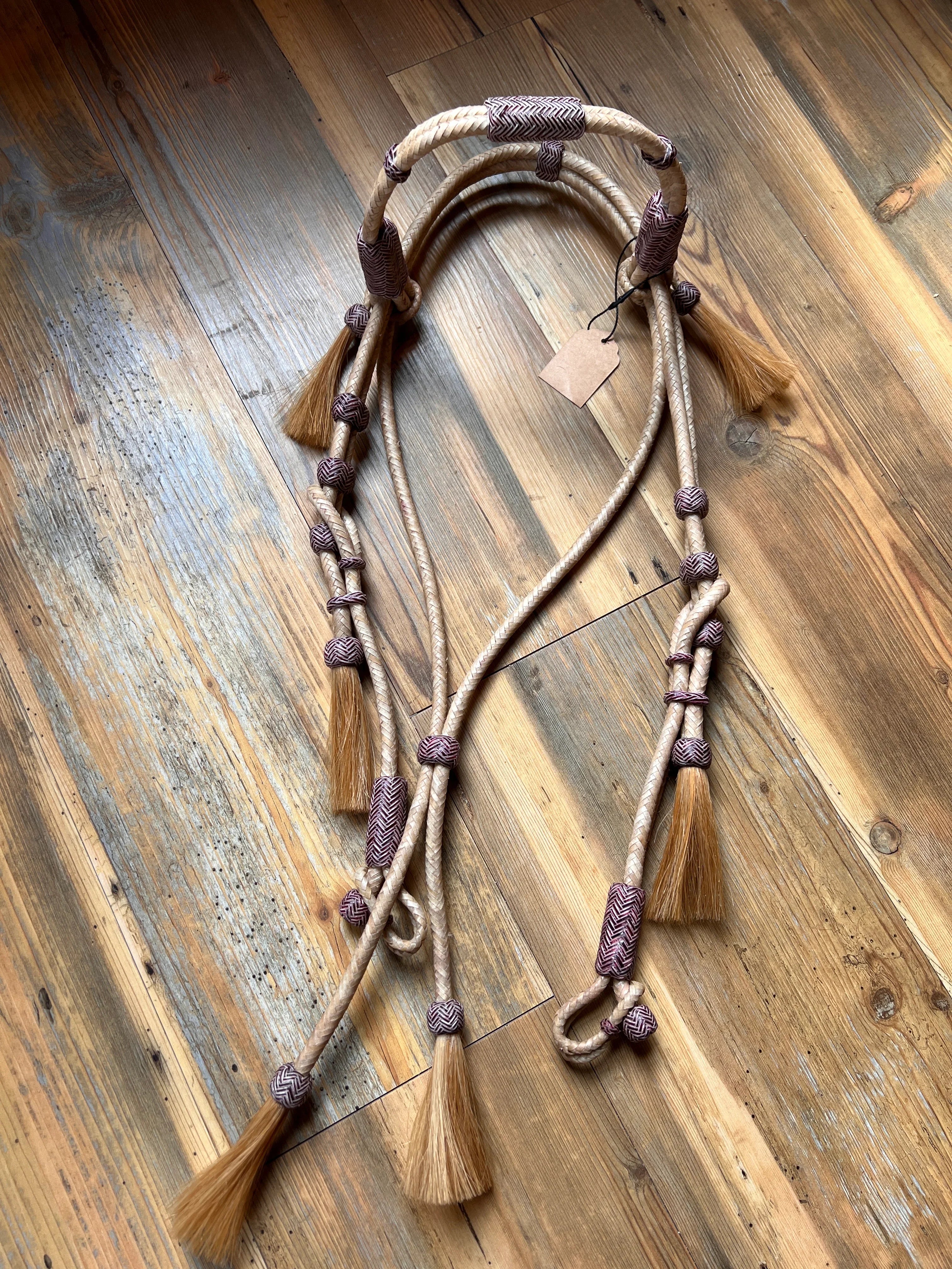 Rawhide Broadband Headstall beige braided rope halter with purple accents, tan tassels