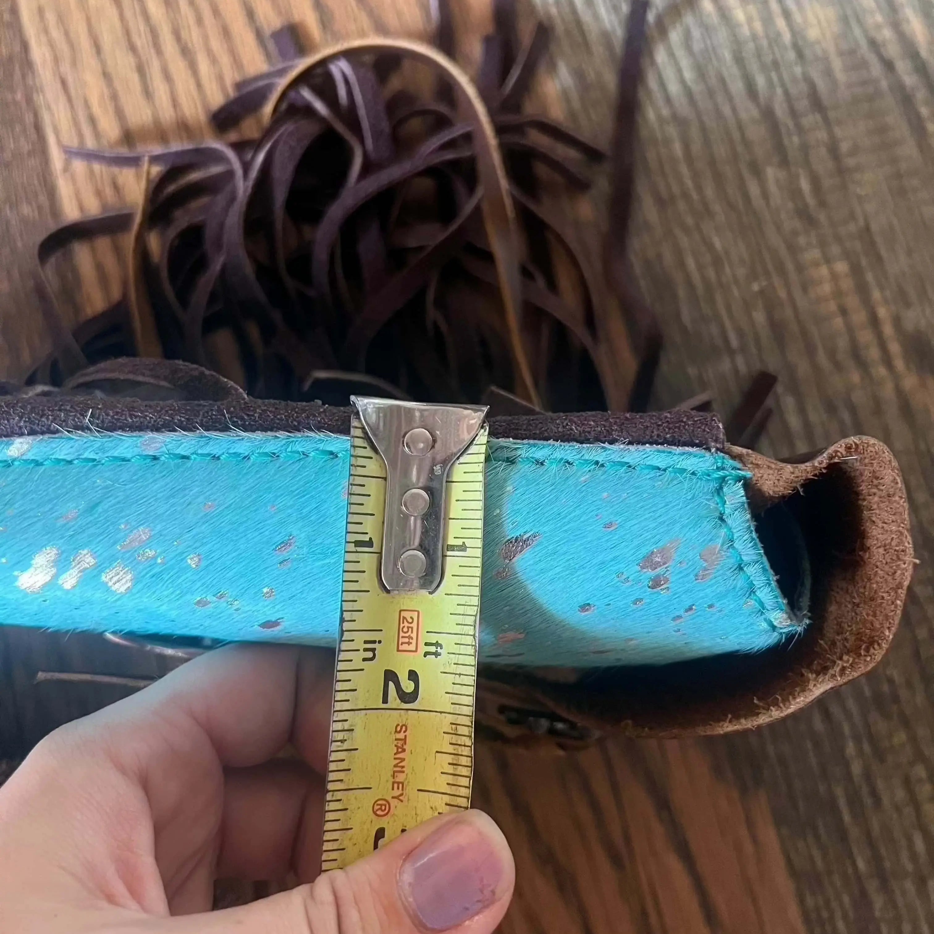 Turquoise brown leather wallet with fringed detailing on Acid Wash Teal saddle bag rear cinch