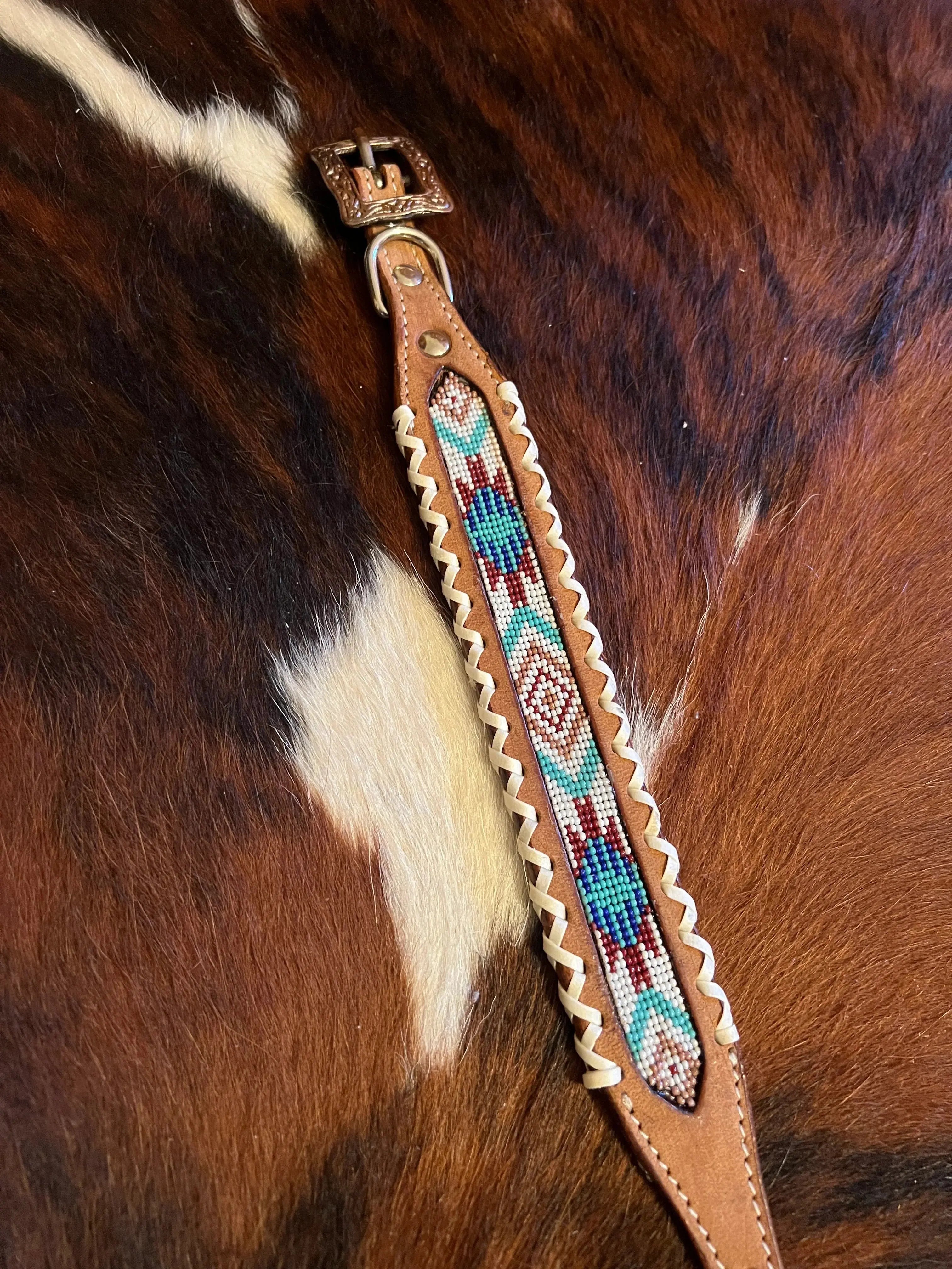 Tan leather halter strap with turquoise, red, white Navajo beaded geometric design