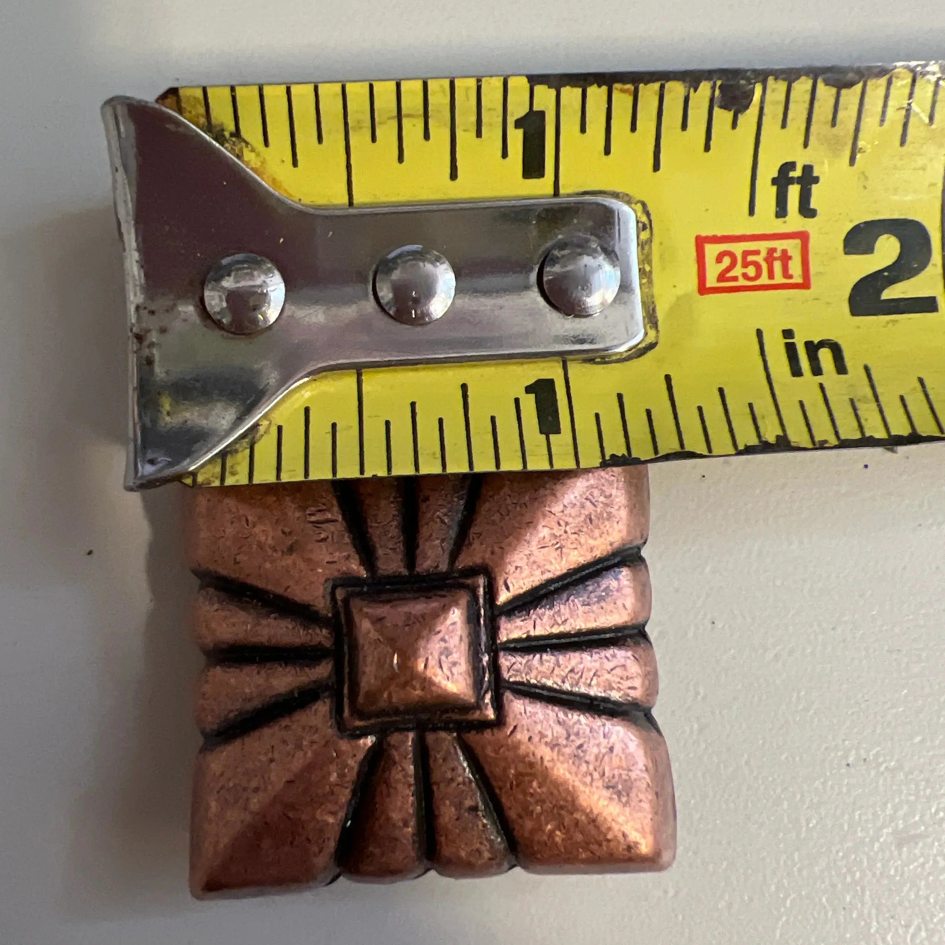Copper pyramid embossed shape concho