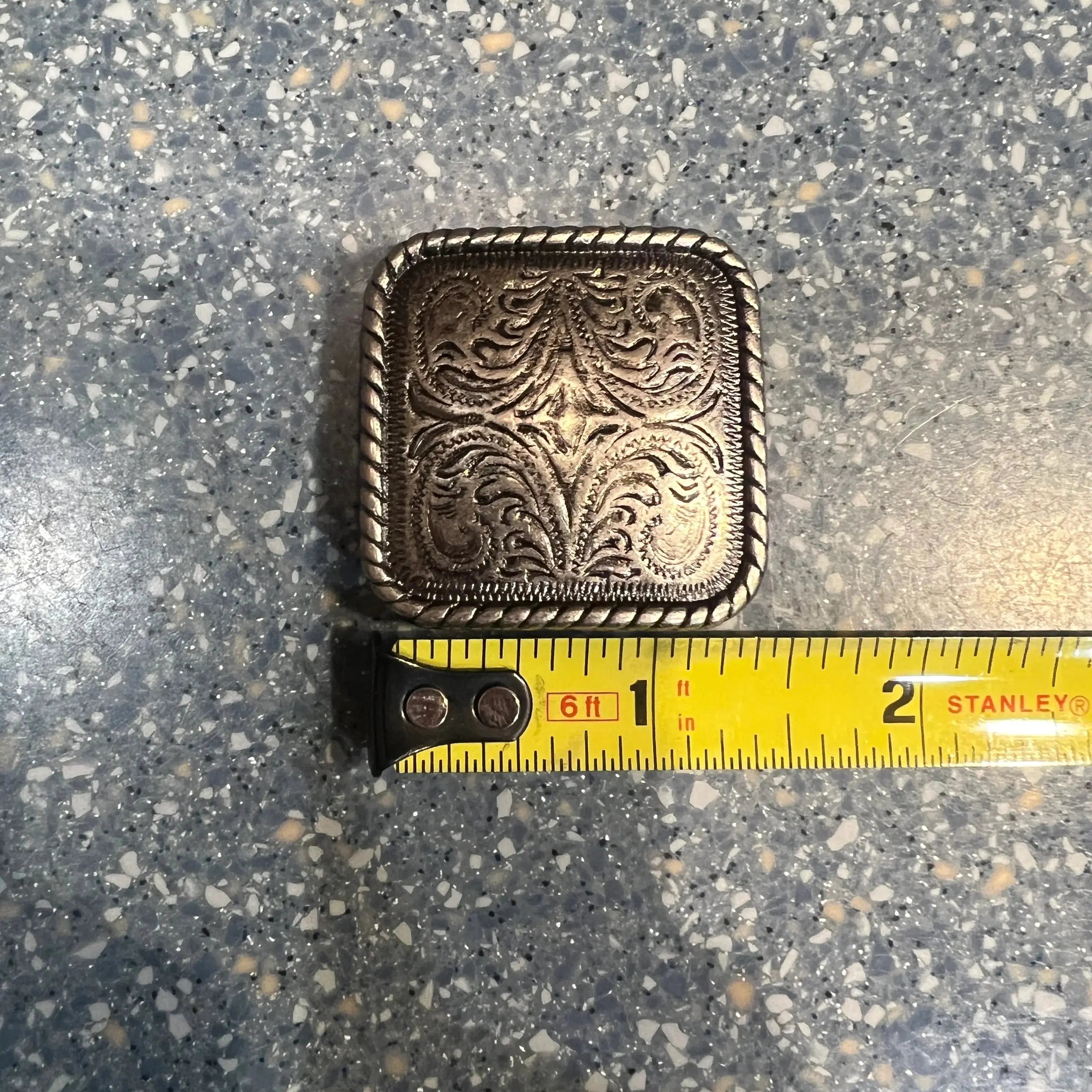 Silver engraved square concho with screw