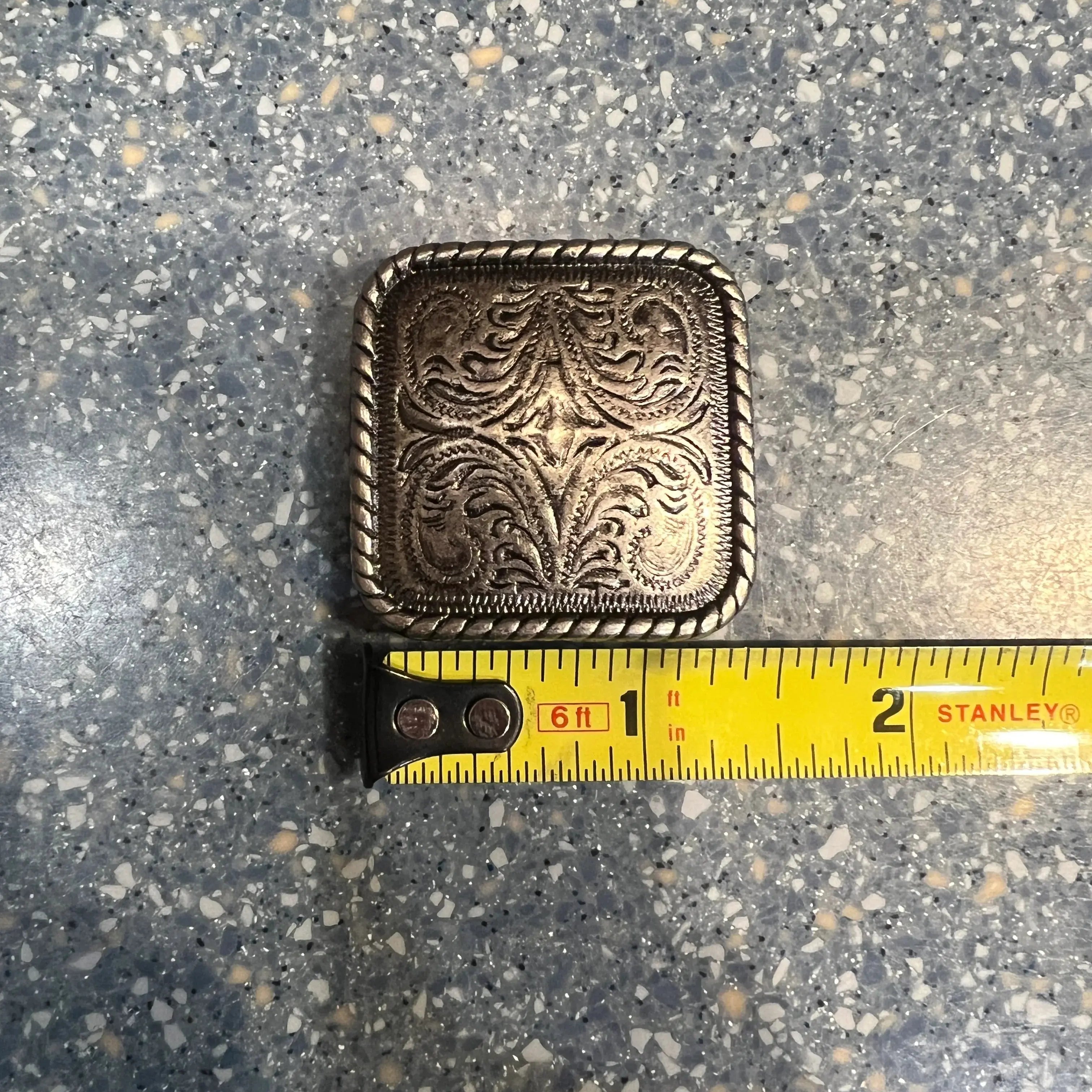 Silver engraved square concho with screw