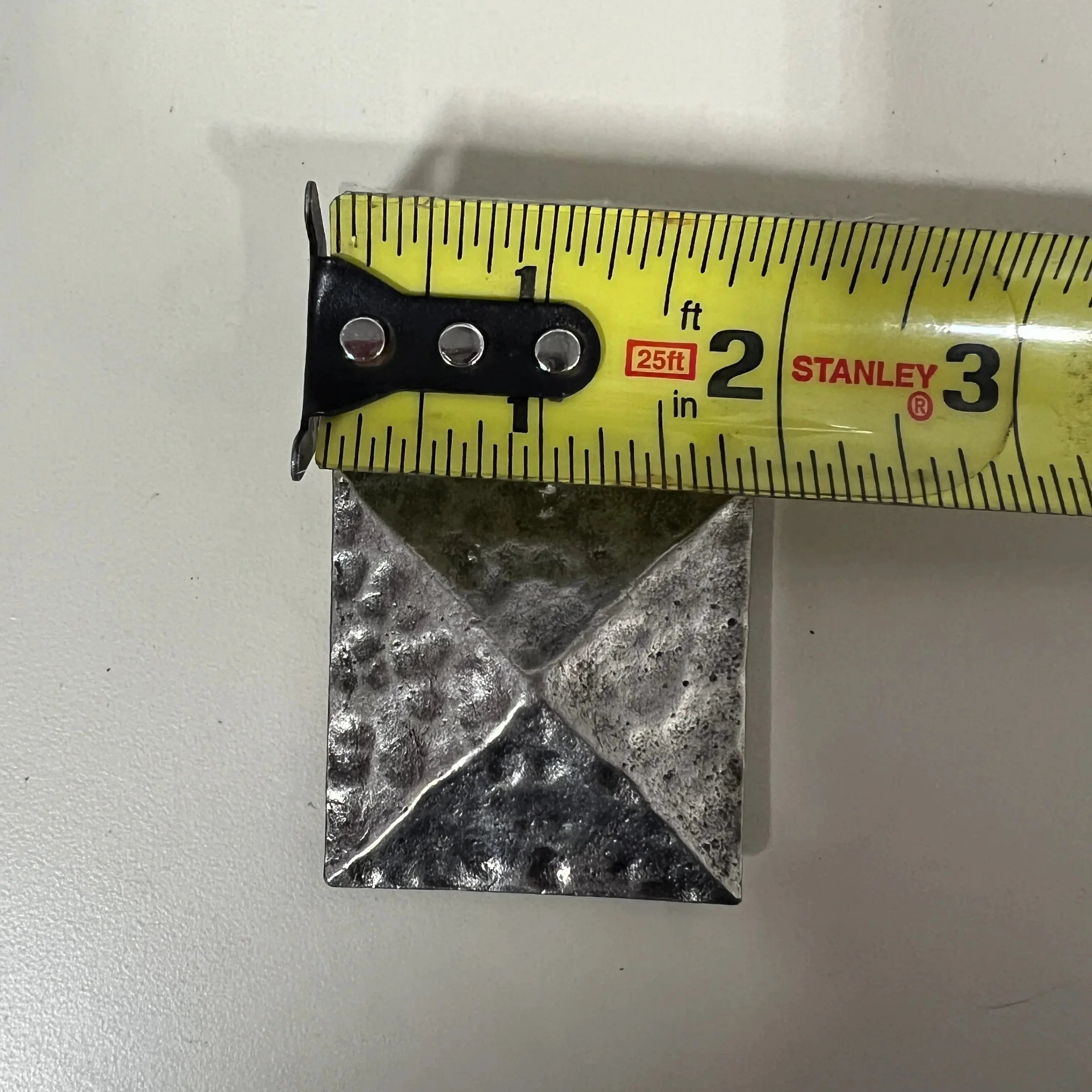 Silver pyramid shape concho with Screw.