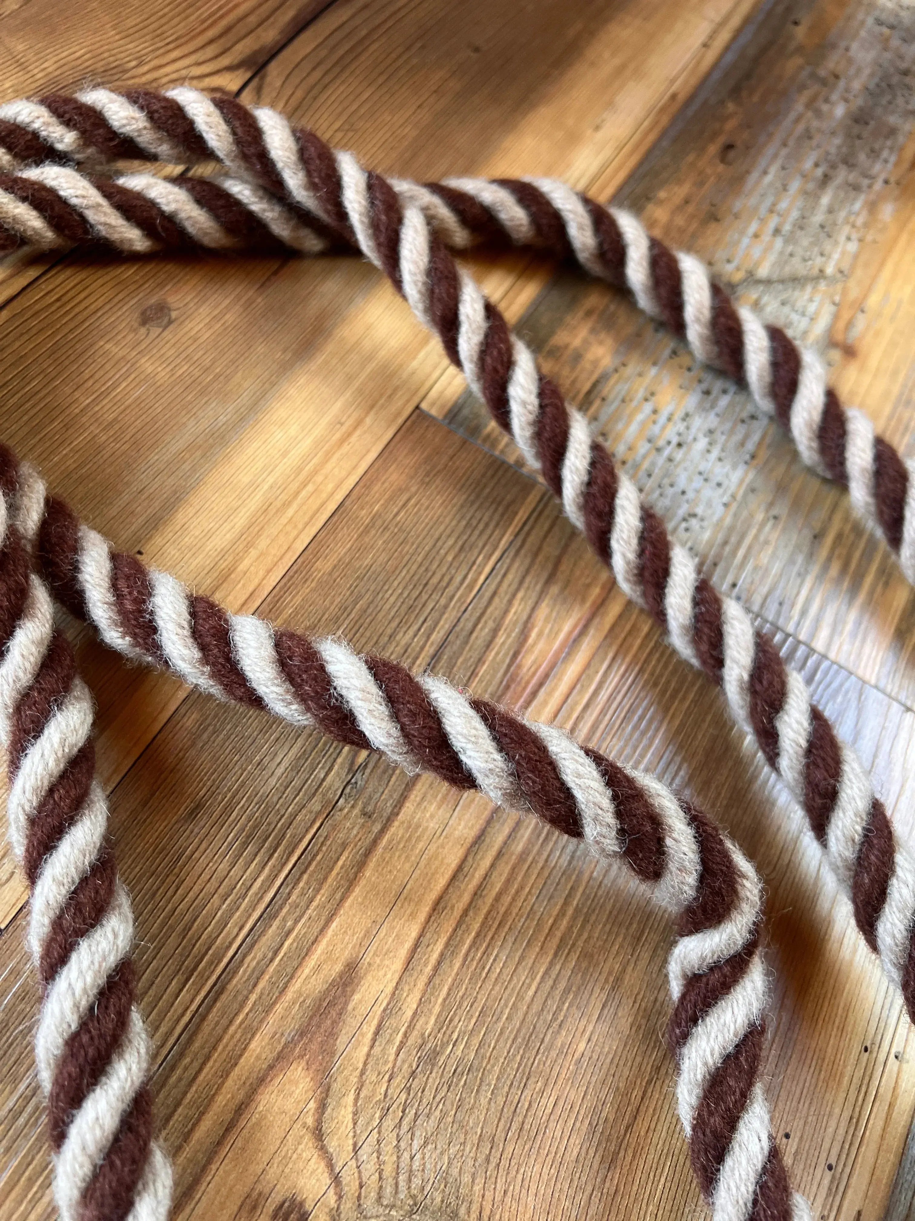 Rustic mocha mohair contest reins, brown cream twisted rope on wood, 8 ft
