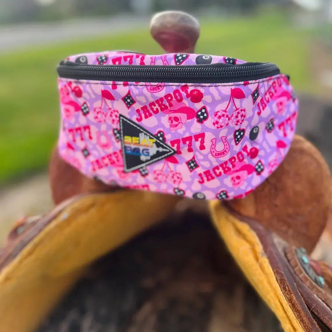Pink patterned Jackpot saddle bag with gambling graphics in The BEAT BAG