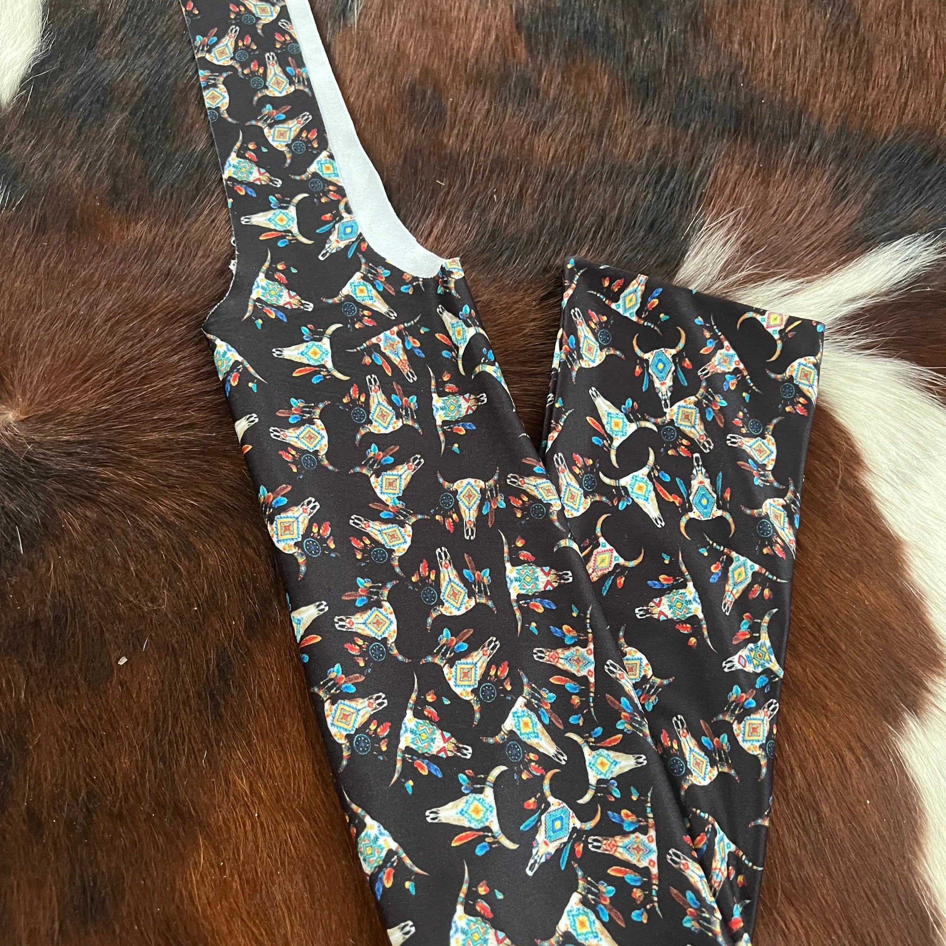 Cow skull printed slip on tail bag