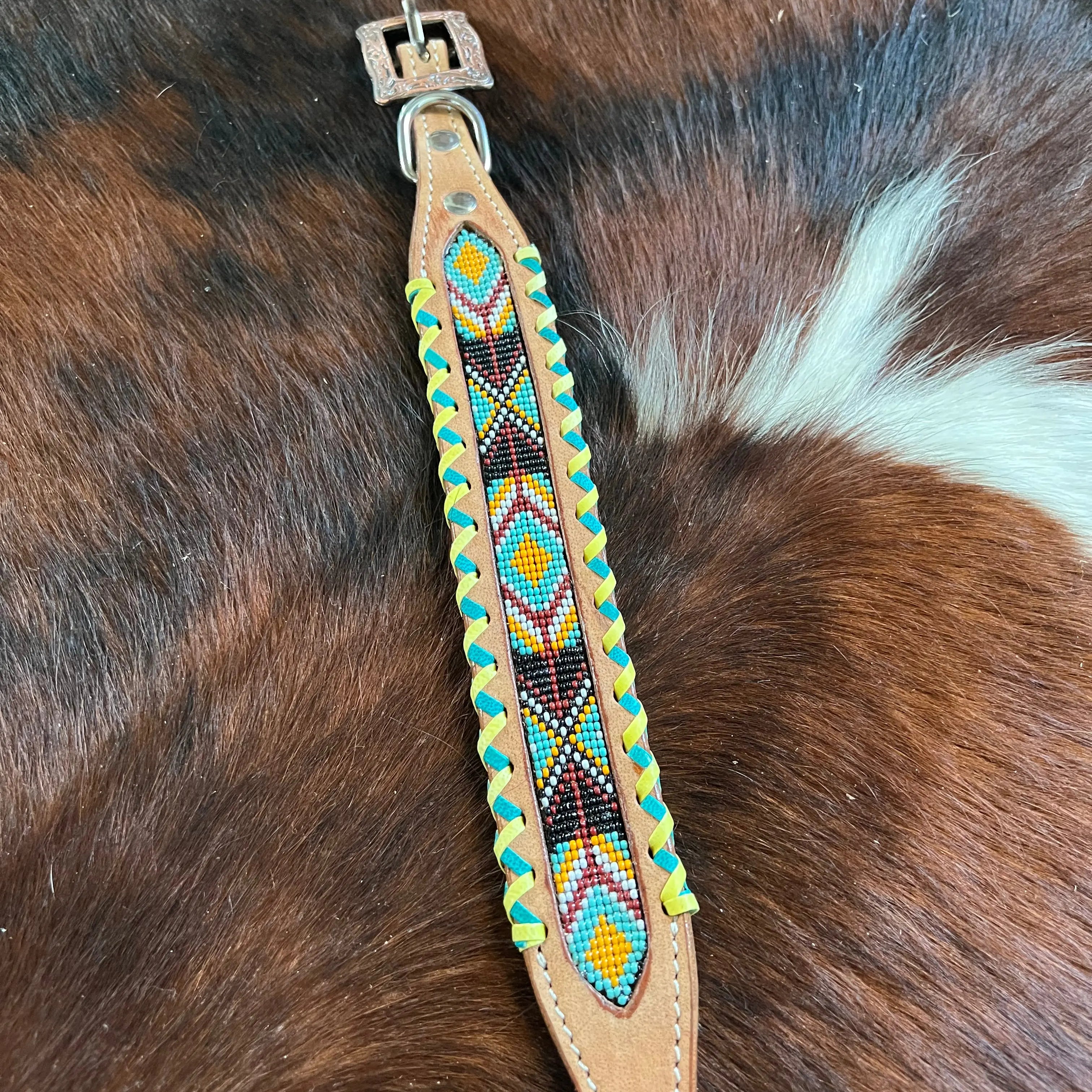 Genuine leather dog collar with teal, white, yellow and burgundy southwest beaded inlay design, a rawhide wrapped edge Dog