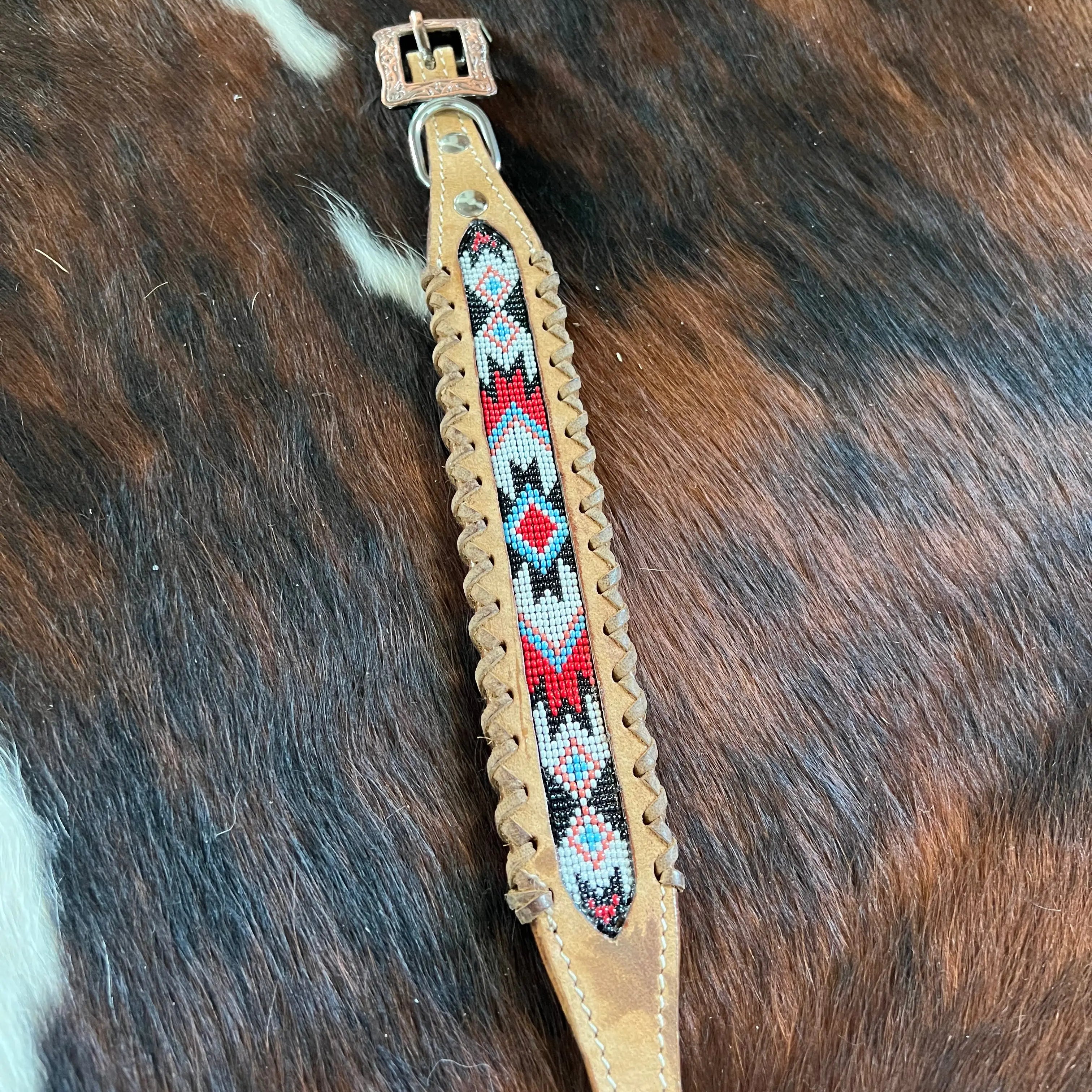 Genuine leather dog collar with red, white, and black southwest beaded inlay design, a leather wrapped edge Dog