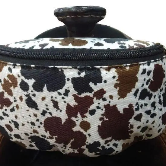 Cow print insulated nylon saddle pouch with black brown spots and leather handle