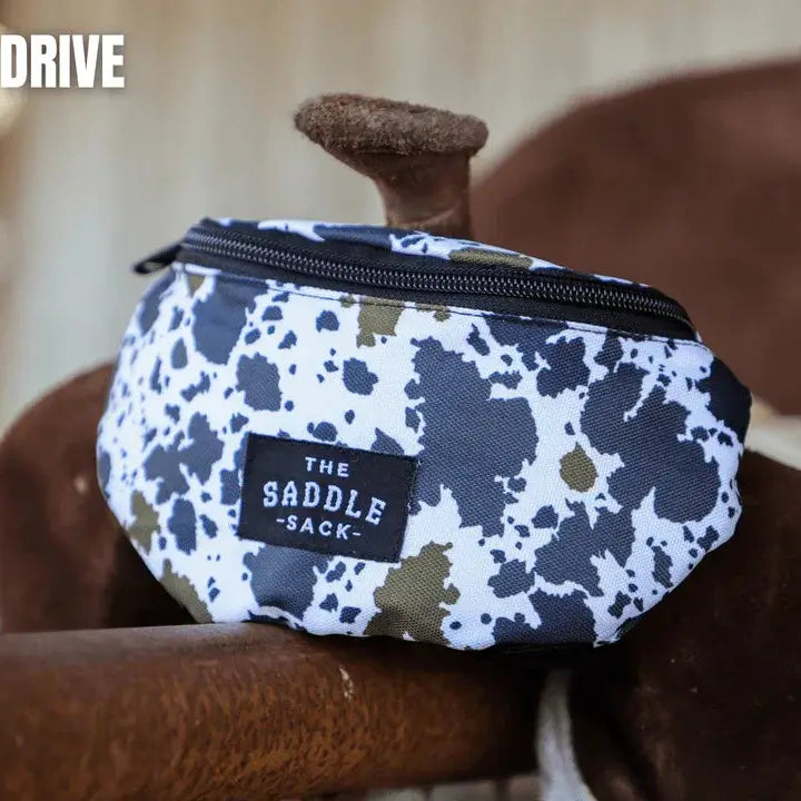 The Saddle Sack white black speckled with olive green accents black zipper patch