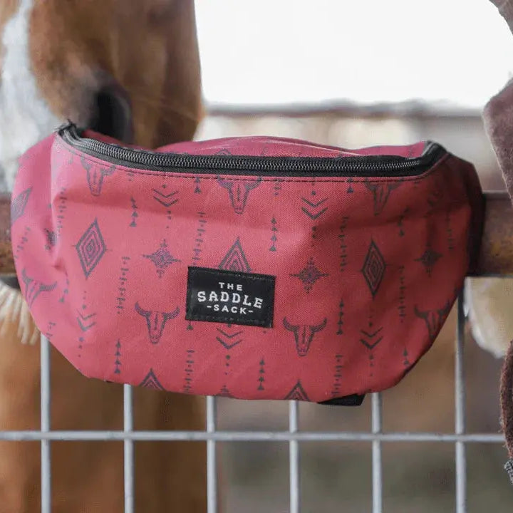 Saddle Sack XL pink fanny pack with black cow skull design