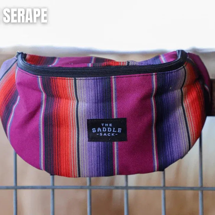 Vibrant purple Saddle Sack XL serape fanny pack with red orange stripes