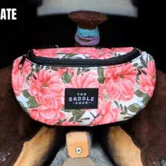 Pink floral fanny pack The Saddle Sack with black trim and label