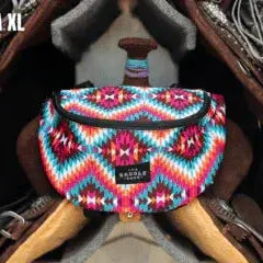 Vibrant geometric Saddle Sack XL bag in pink blue teal with black zipper