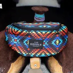 Vibrant geometric Gaddell Saddle Sack fanny pack in teal, orange, red on leather saddle