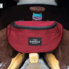 Maroon Saddle Sack bag with black trim and rectangular label