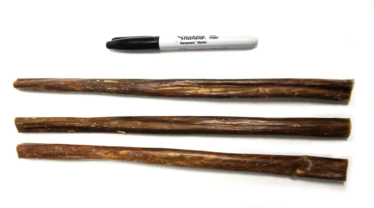 Three 12-inch brown textured gullet stick dog chews laid horizontally