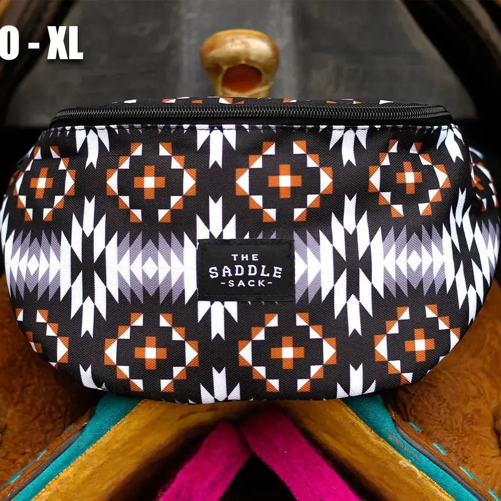 Saddle Sack XL: black, white, orange geometric fabric saddle sack with zipper