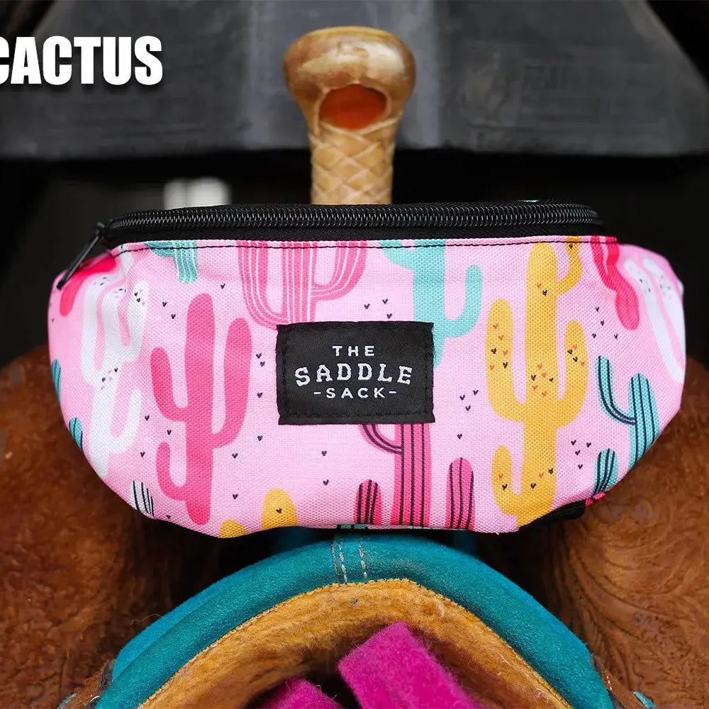 Pink cactus-patterned Saddle Sack with cartoon cacti and black zipper