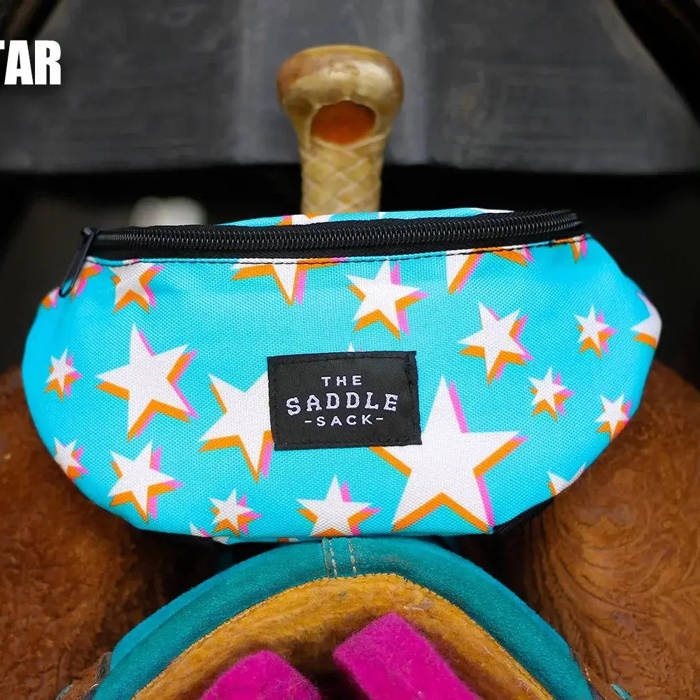 Turquoise Saddle Sack with white stars, orange outlines, black zipper