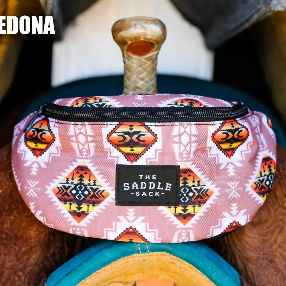 Pink Saddle Sack fanny pack with orange, black, white geometric tribal patterns