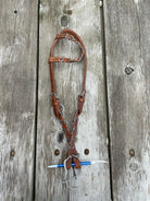 Brown leather horse halter with cheetah print lacing and metal hardware