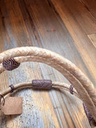 Rawhide Broadband Headstall with beige braided rope handle and herringbone fabric accents