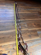Brown and white 20-plait romal reins, chestnut cherry rawhide, 55 inches
