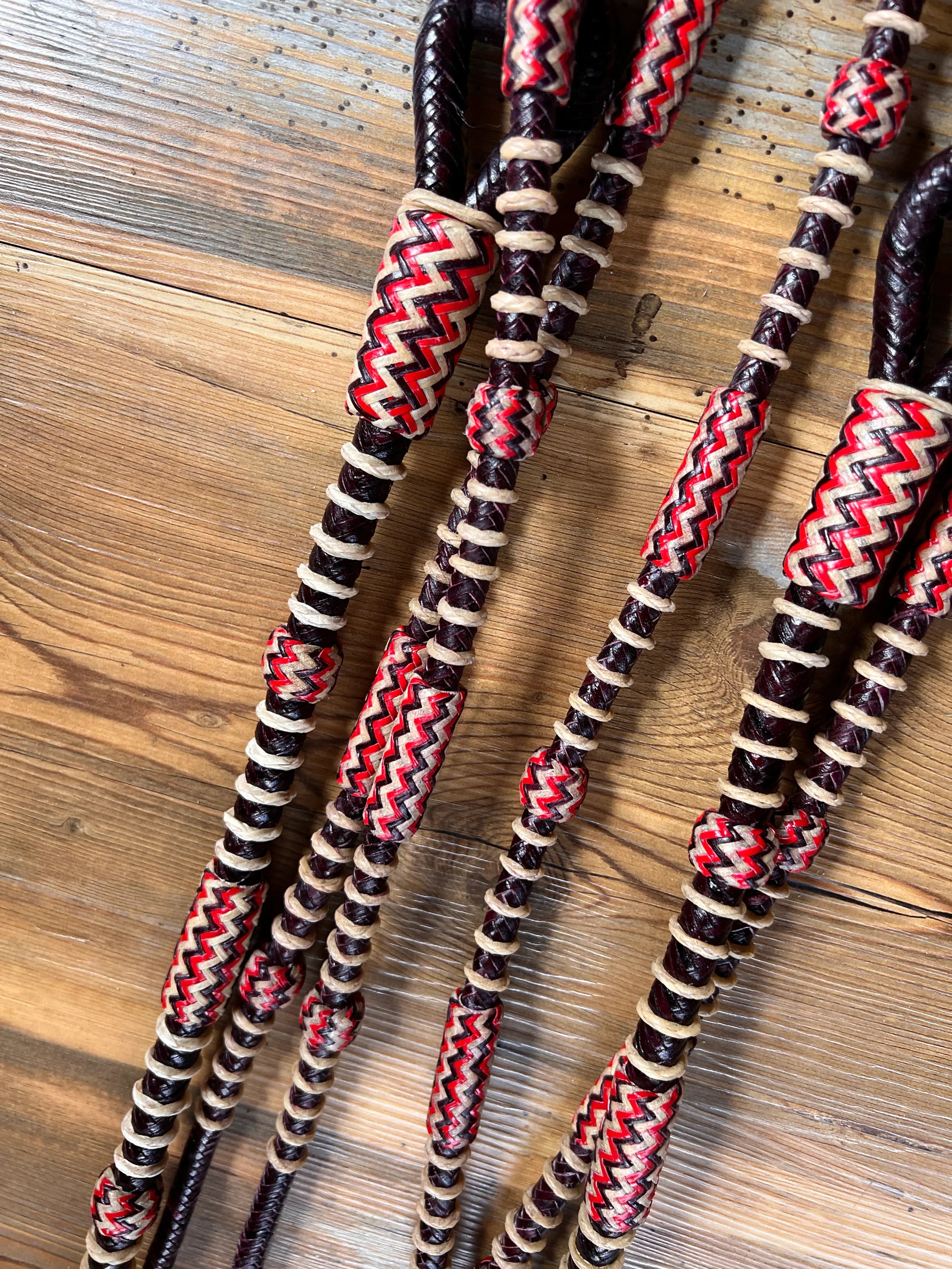 Red and cream zigzag leather Romal reins California style 20 plaits dark cherry