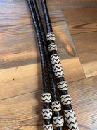Black braided leather Romal reins with cream zigzag beads, 10 plaits, 55