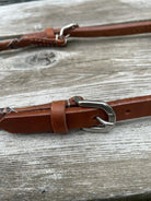 Brown leather Argentina cow harness headstall with silver buckle, cheetah lacing
