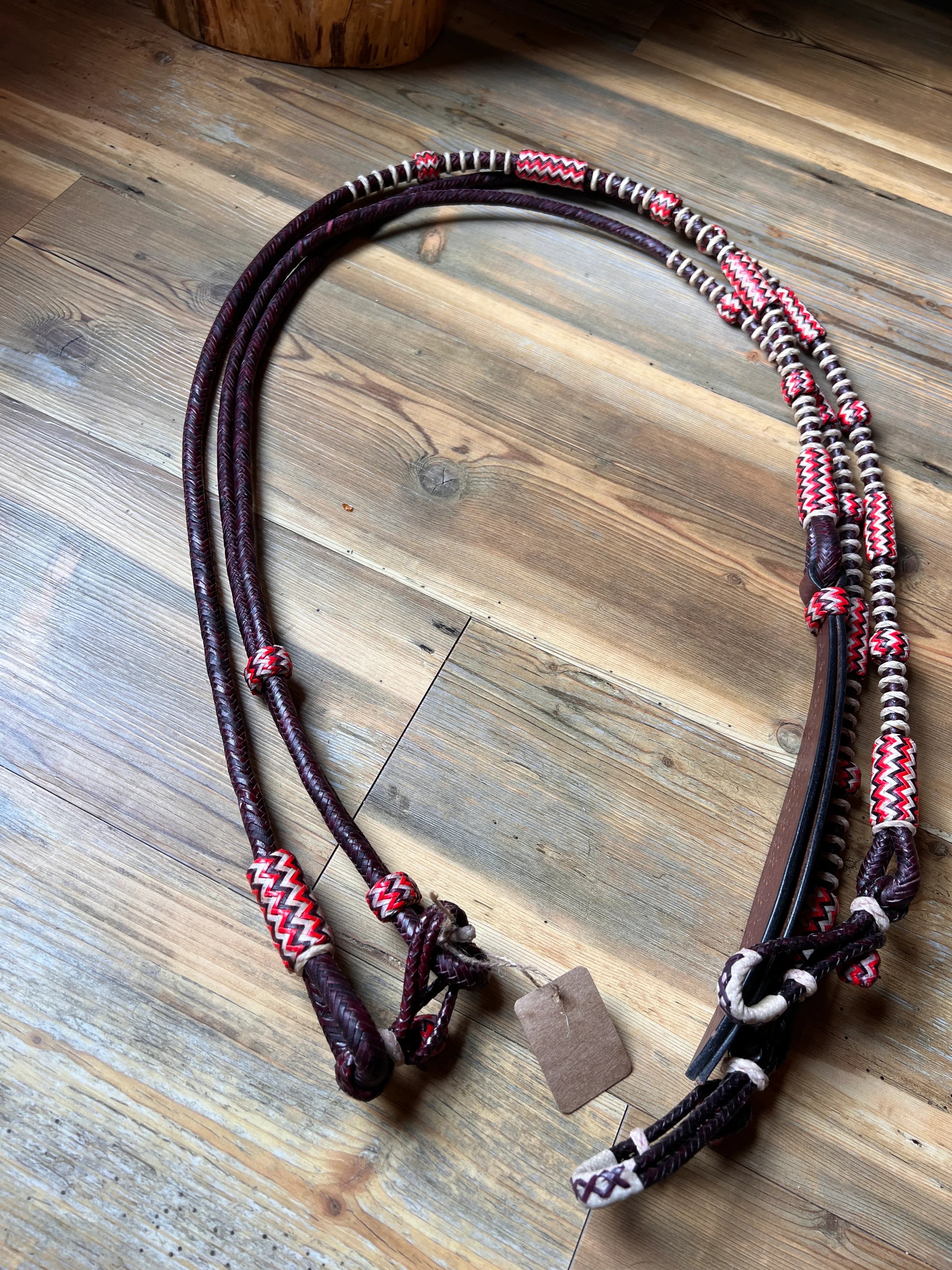 Maroon and white braided leather horse halter with zigzag patterns, dark cherry style