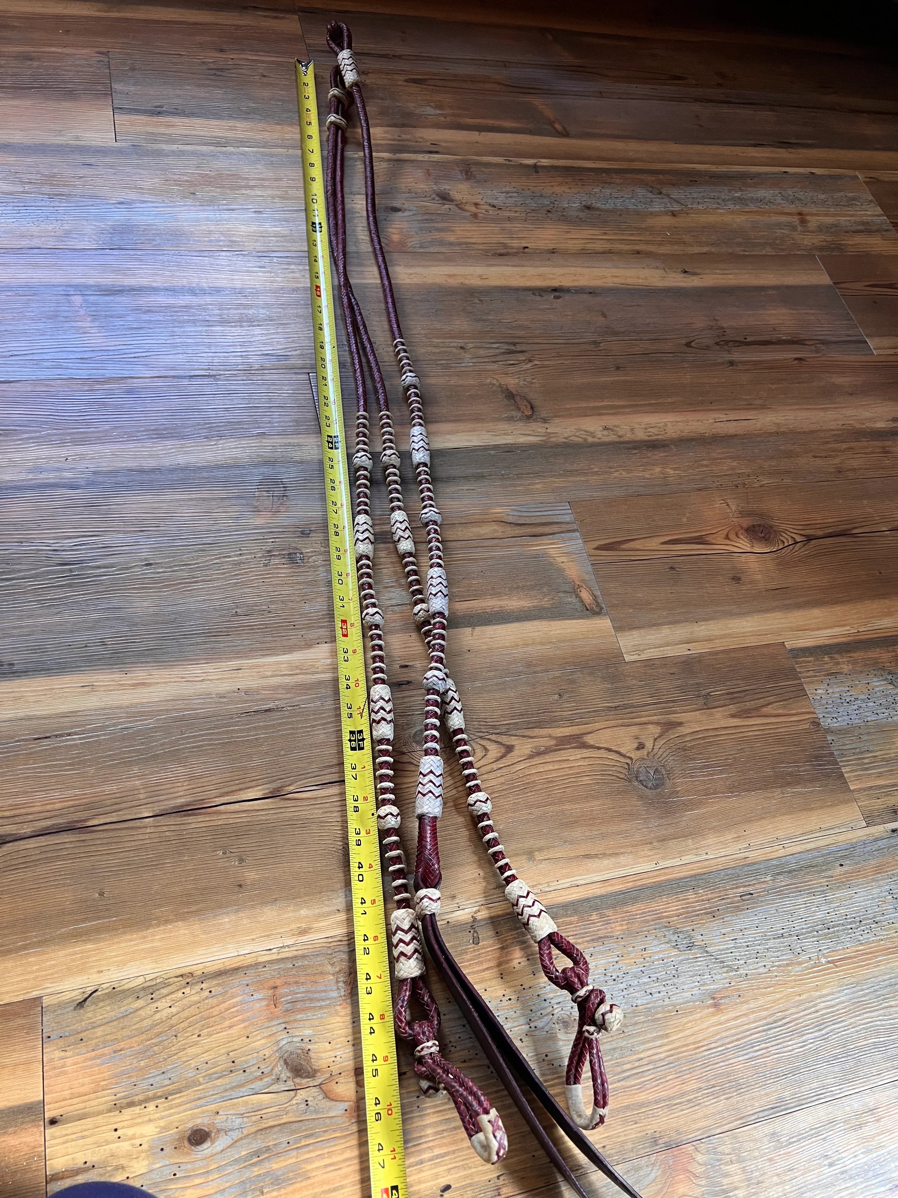 Brown and white 20-plait romal reins, California style, 55 inches with connectors