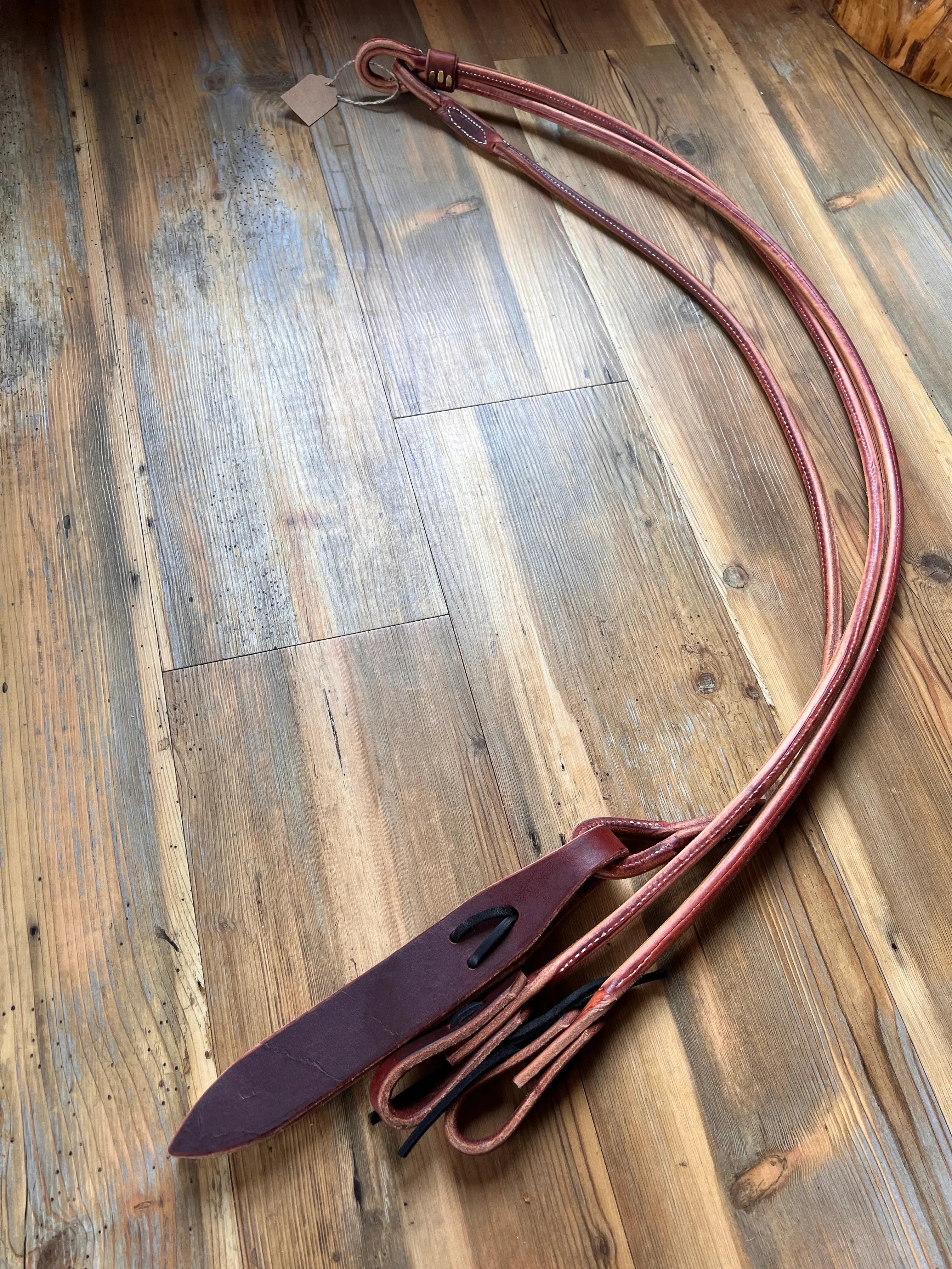 Brown leather horse halter with dark brown strap, black stitching, USA-made