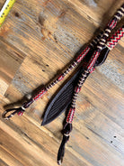Red and cream 20-plait braided romal reins with black textured leather, 55 inches