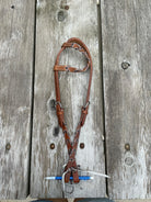 Brown leather Argentina horse halter with cheetah print braided pattern