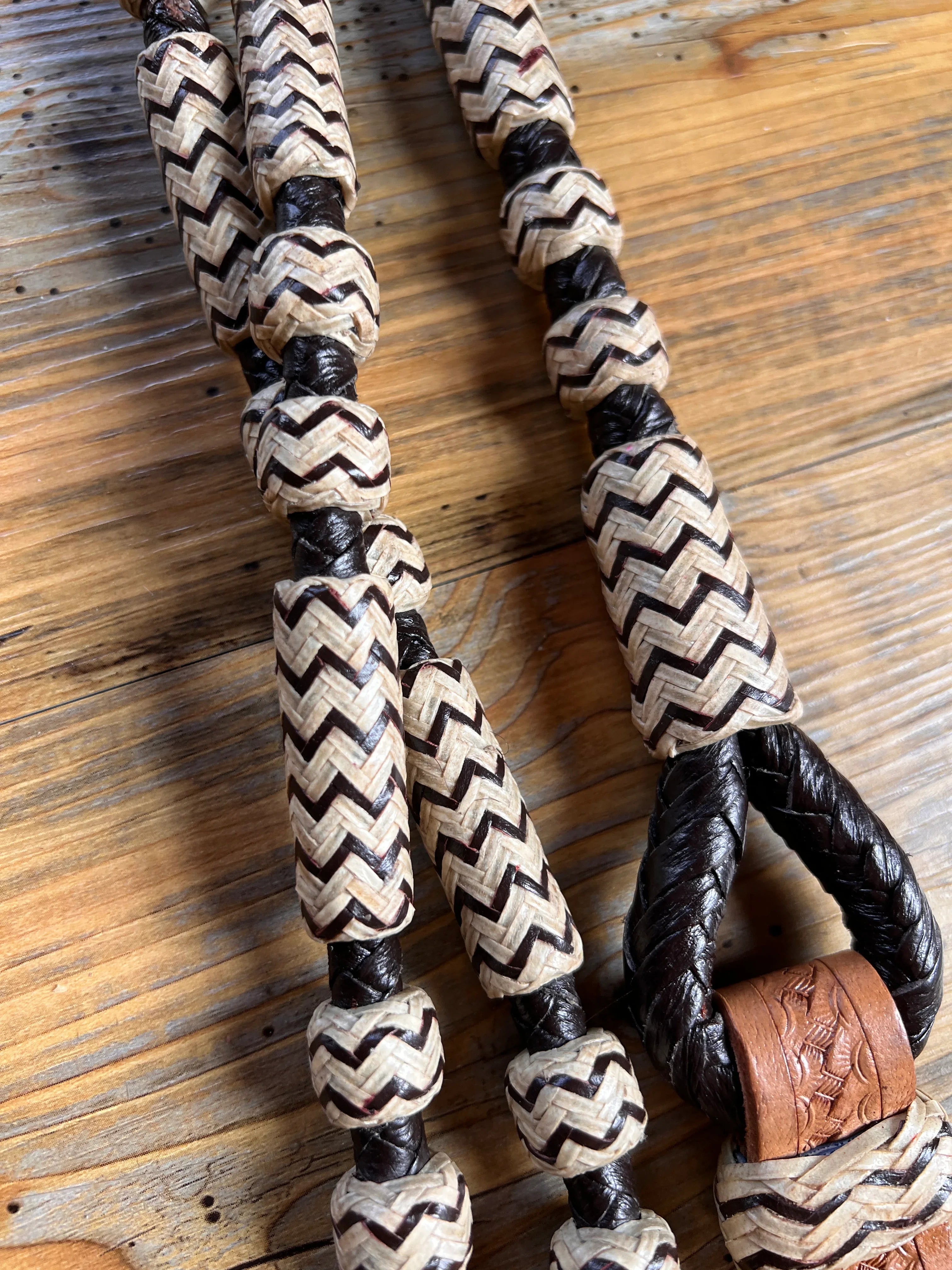 Black and cream chevron leather lanyard with braided ends for Romal reins