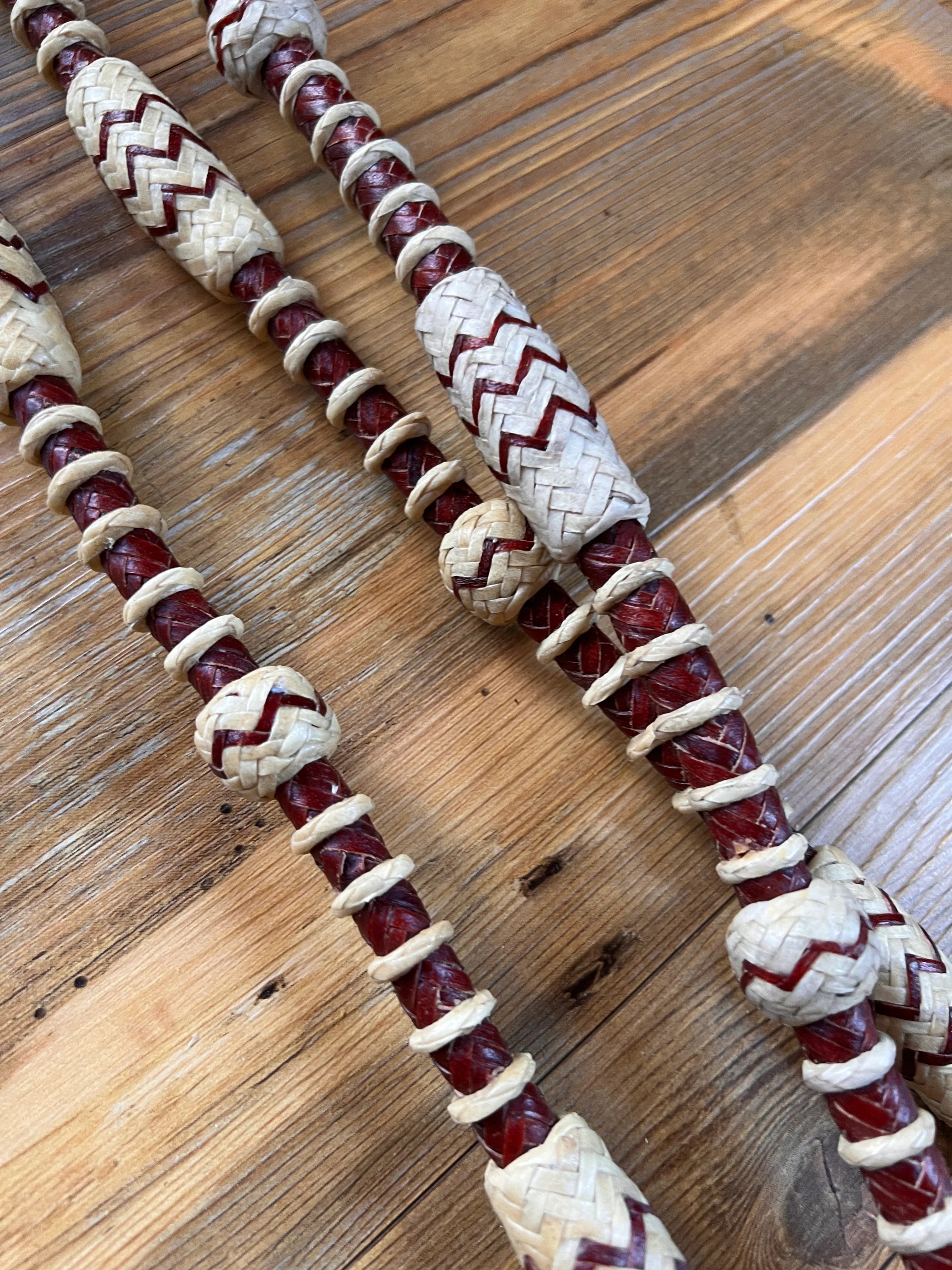Red cream woven leather Romal reins with zigzag beads 20 plaits California style